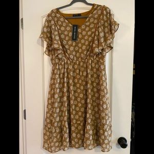 Mustard yellow dress with floral pattern. Built in slip.